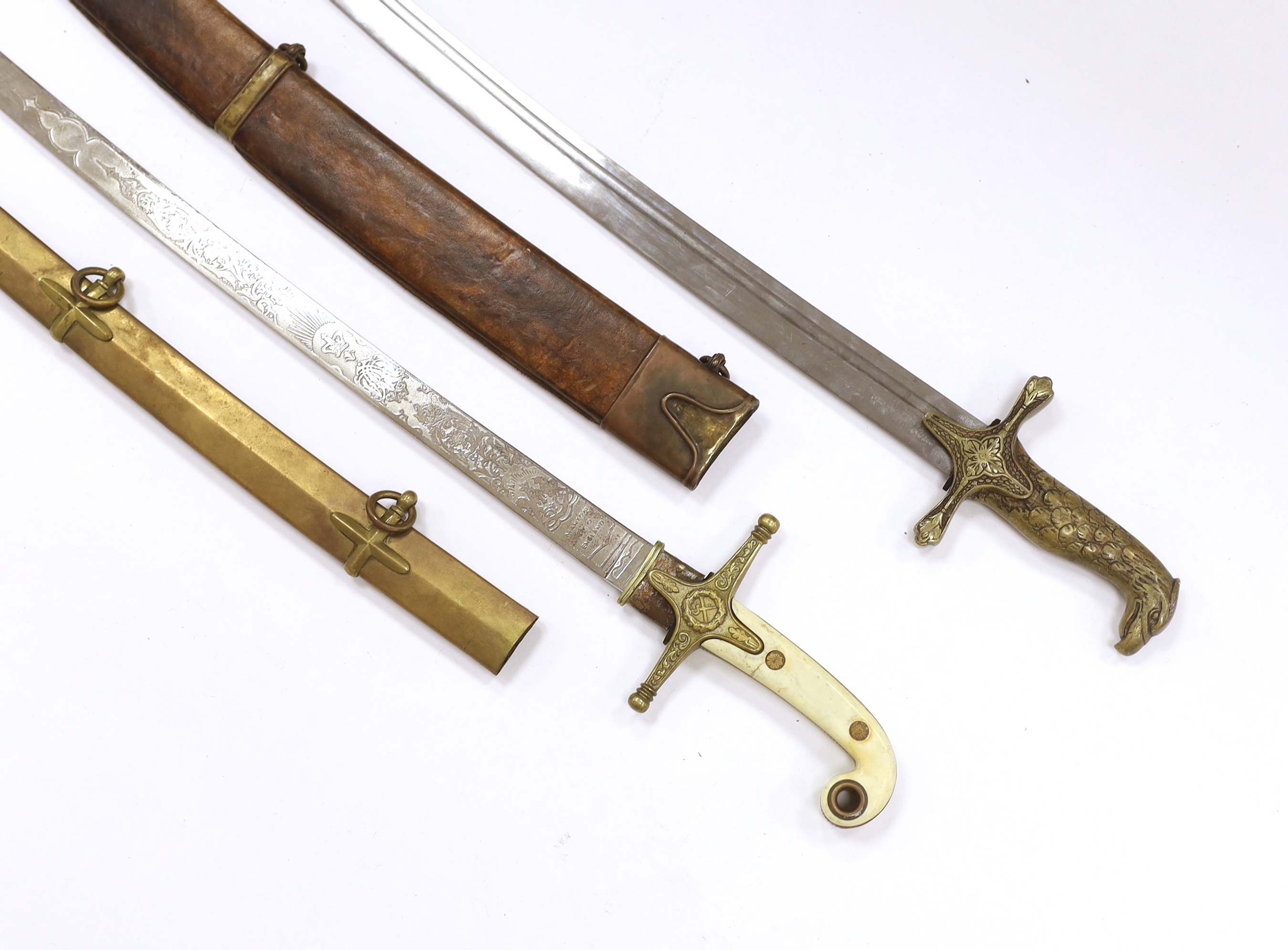 Two reproduction swords; a Victorian style naval design Mameluke sword, together with an Indian style sword, longest blade 84cm